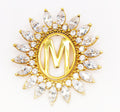 Dije de oro macizo de 18K con borde de circonitas en forma de M